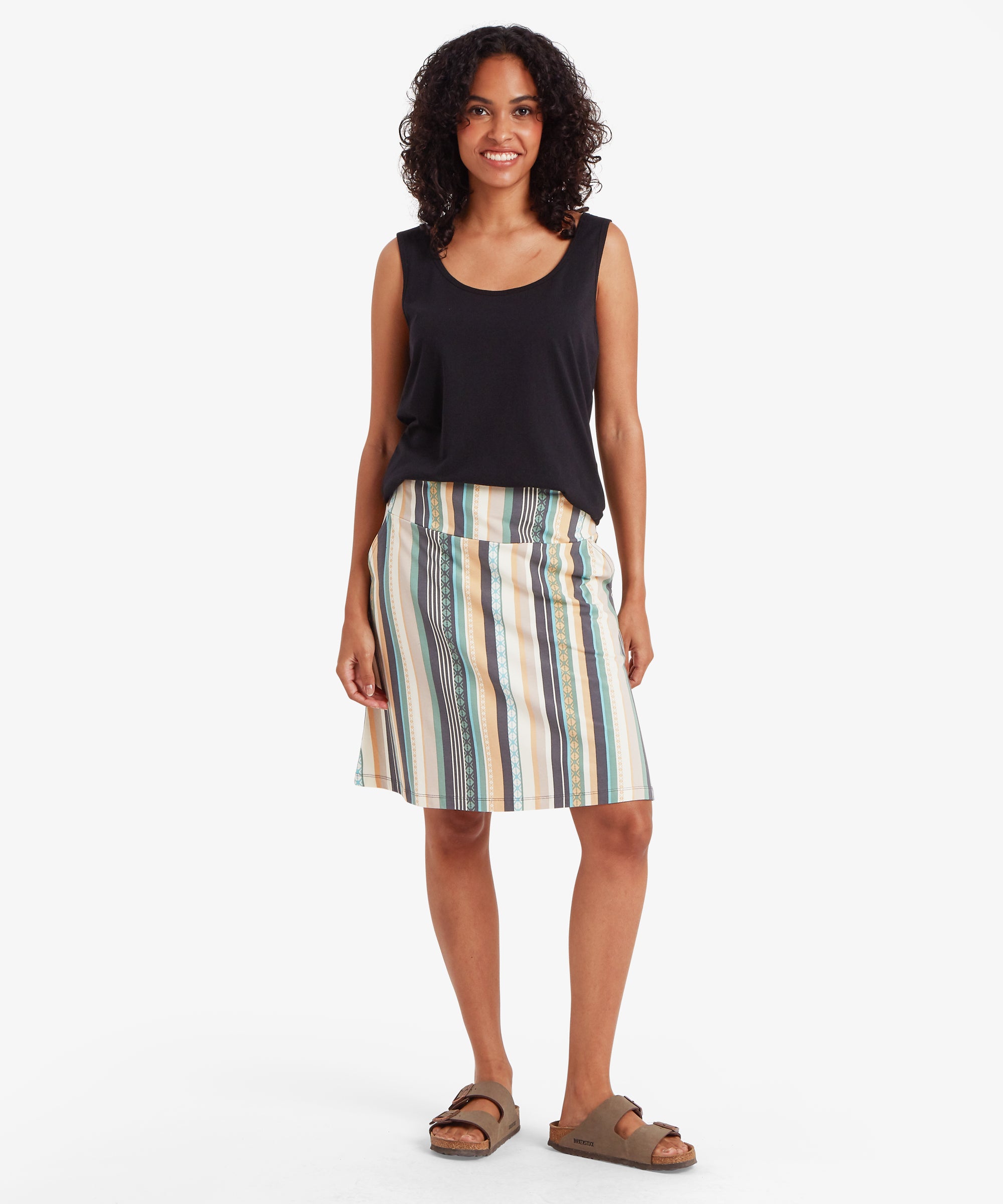 Full-length view of a sleeveless top paired with a knee-length A-line skirt featuring vertical stripes in teal, grey, mustard, cream, and black.