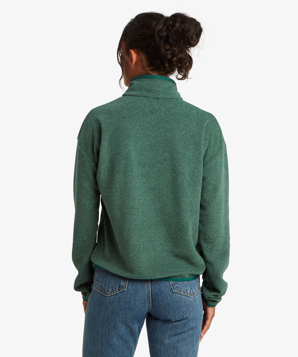 A female model wearing the Sherpa Adventure Gear womenÕs Rolpa 1/2 Zip in green.