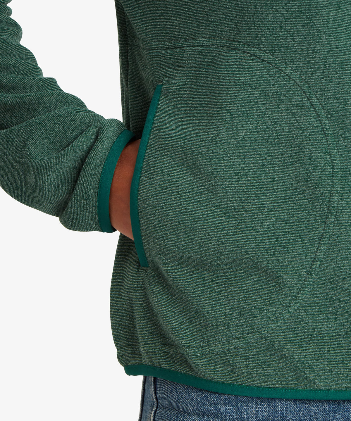 A female model wearing the Sherpa Adventure Gear womenÕs Rolpa 1/2 Zip in green.