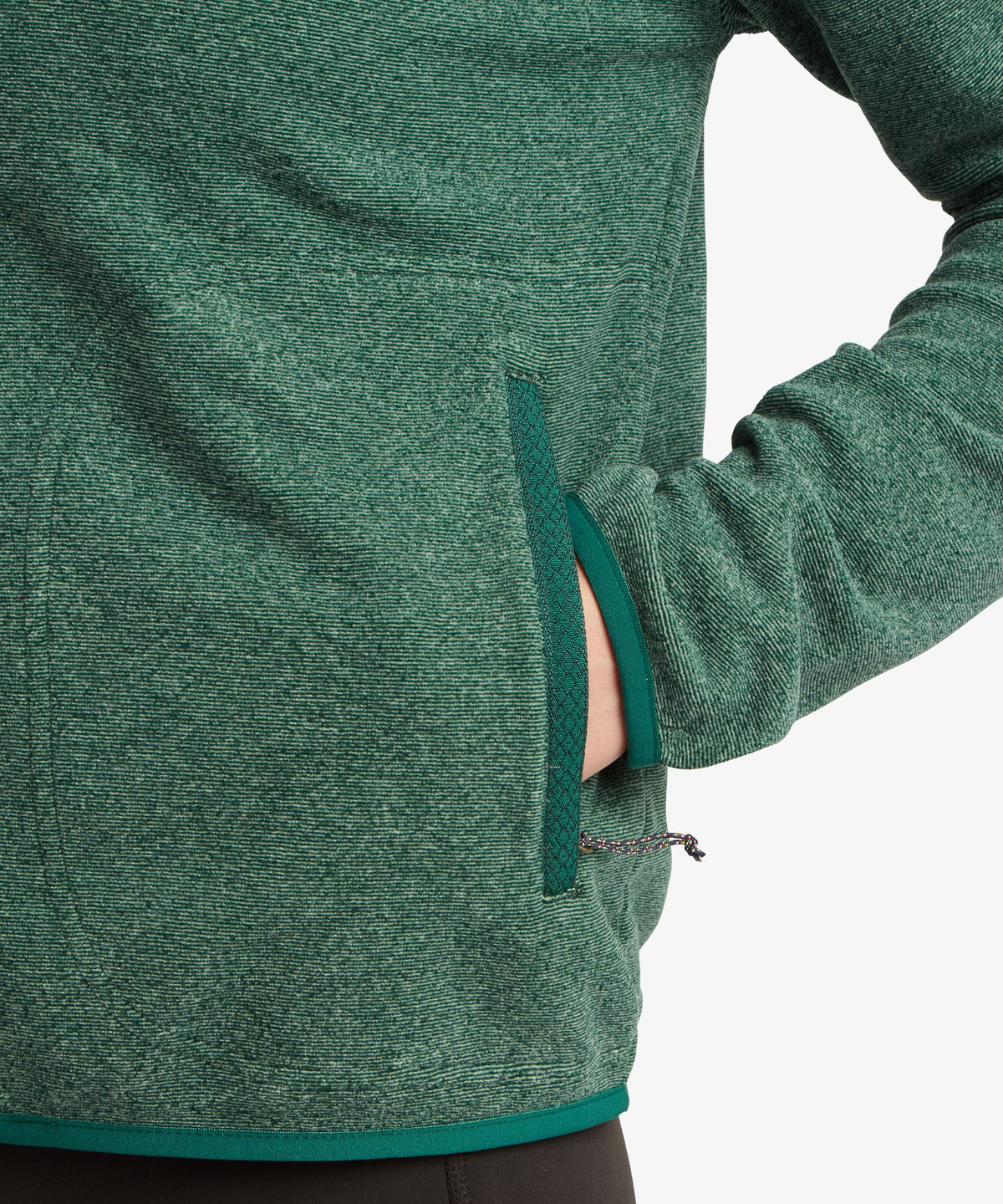 Close-up of a green fleece pullover jacket with a side zippered pocket.
