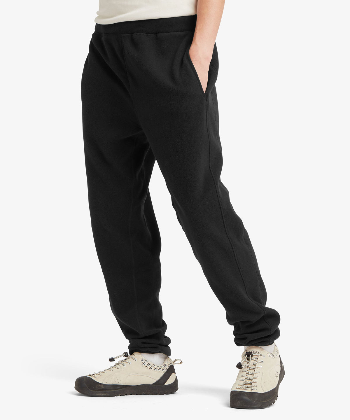 A female model wearing the Sherpa Adventure Gear black Rolpa Jogger trousers.
