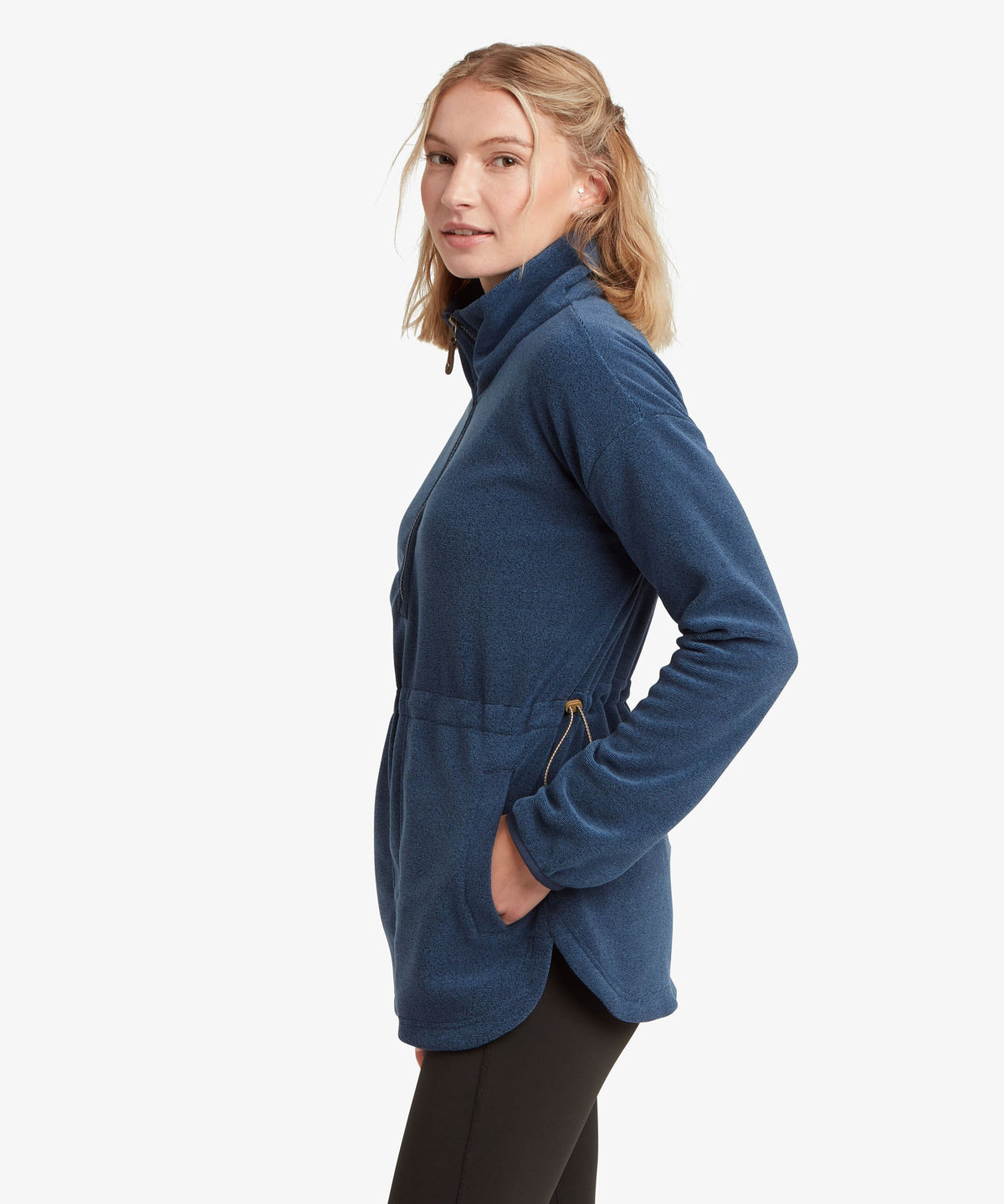A female model wearing the Sherpa Adventure Gear navy Rolpa Pop-Over fleece.