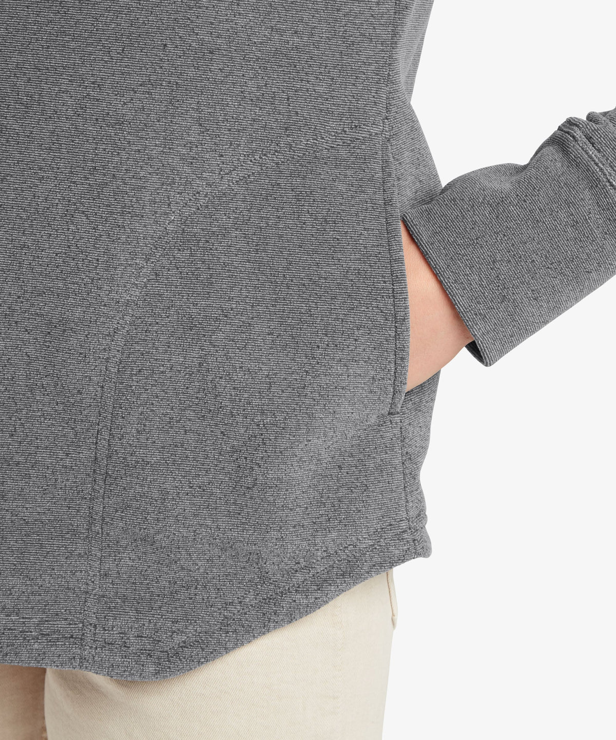 A female model wearing the Sherpa Adventure Gear grey Rolpa Pullover, shown in close-up.