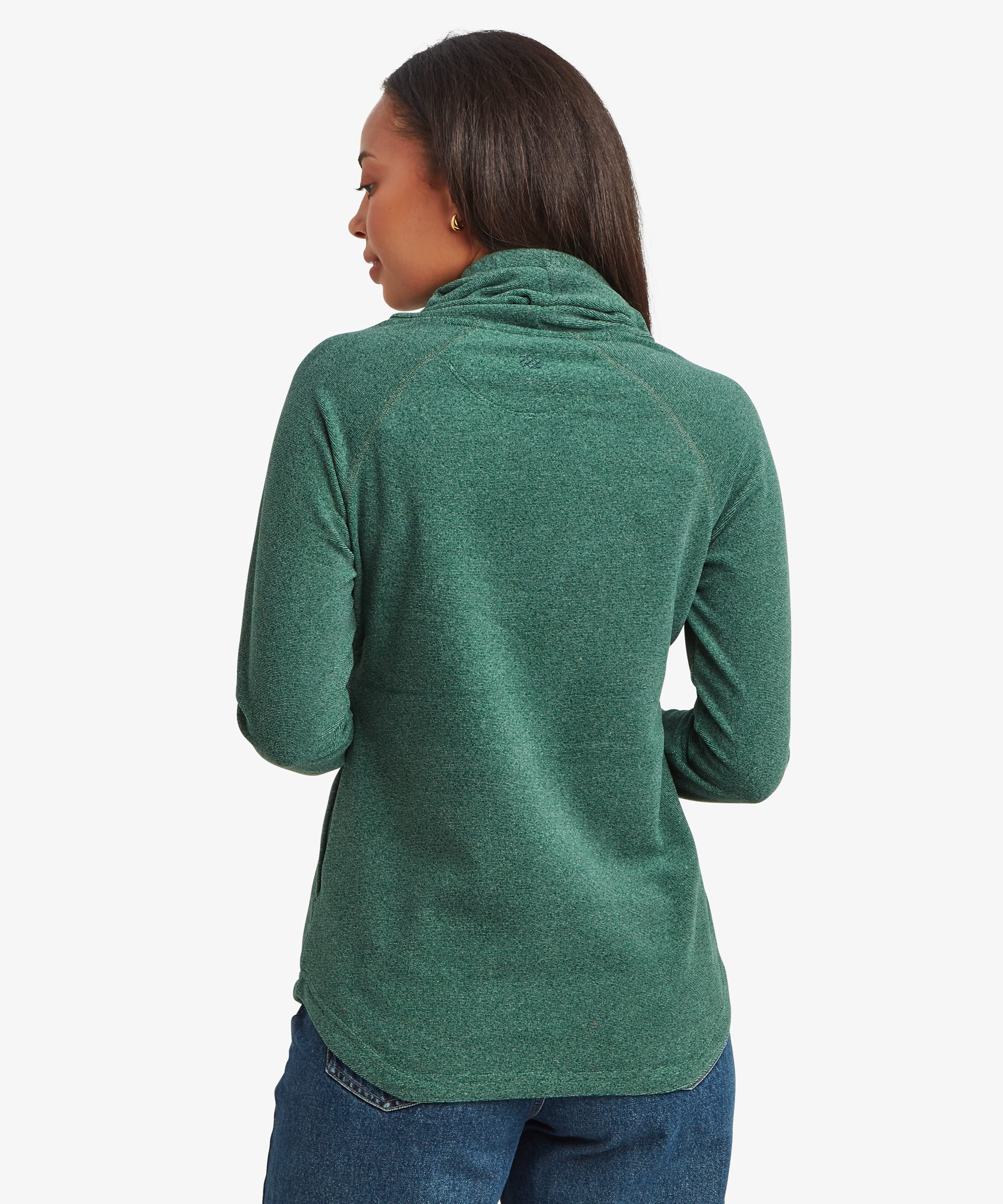 Rear view of a woman wearing a teal green Sherpa Rolpa Pullover. The image highlights the clean back design, relaxed shape and textured fleece fabric.