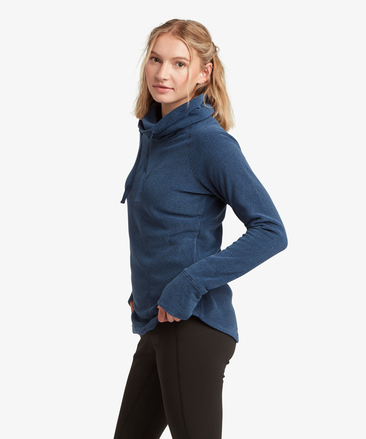 Side profile of woman wearing navy funnel-neck pullover with drawstring detail
