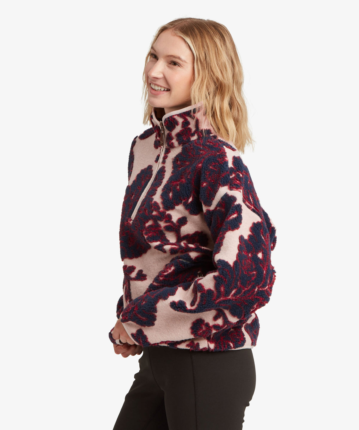 Sherpa Adventure Gear women's Tara 1/4-zip fleece in beige with a burgundy.