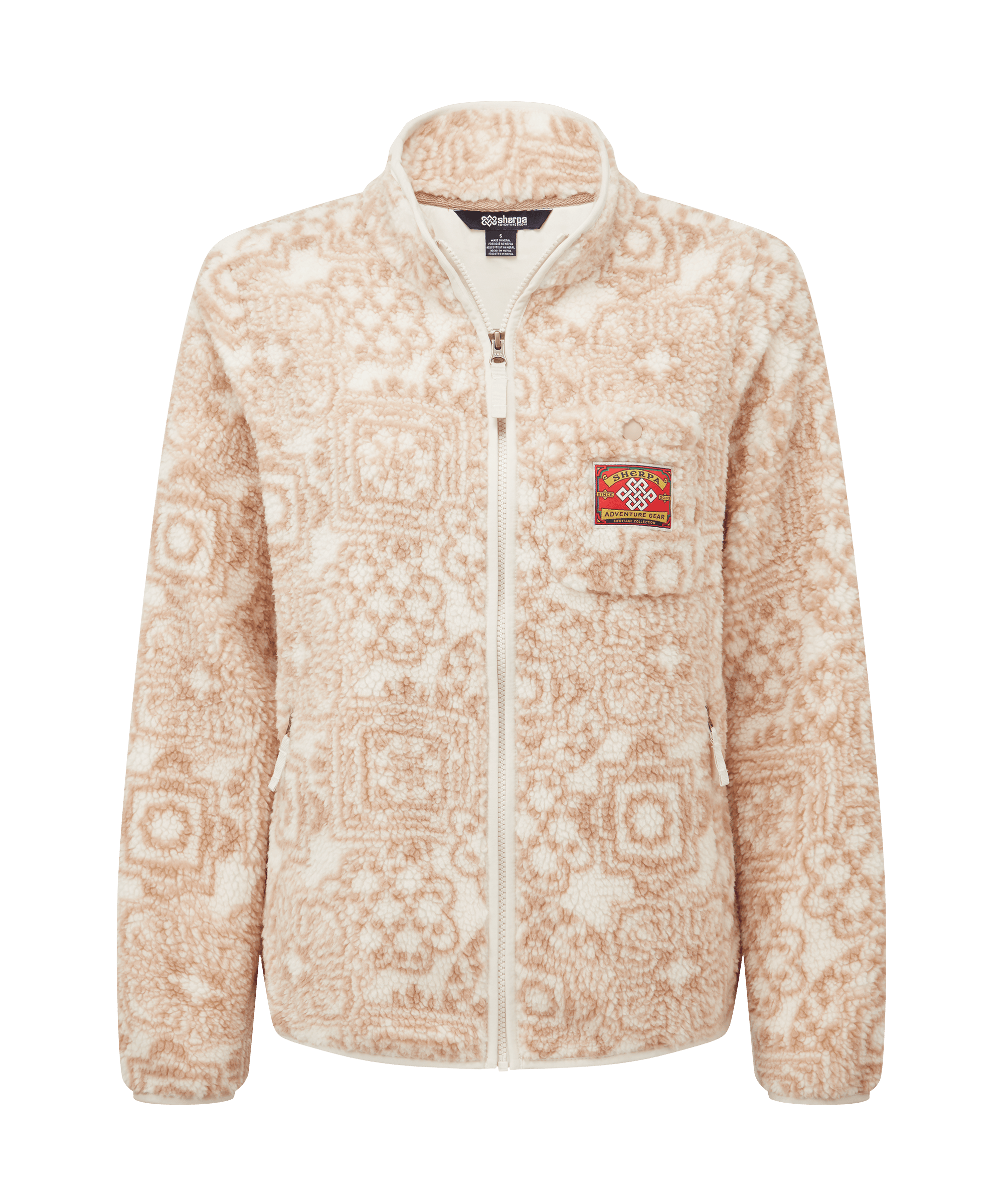 Front view of a women's Sherpa Adventure Gear printed full-zip fleece jacket in soft cream with tonal floral motifs. Features a stand collar, full-front zipper, and an allover pattern that adds subtle texture and visual interest.